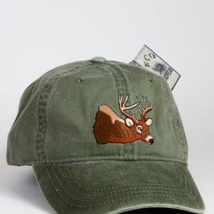 Green cap with embroidered deer design.